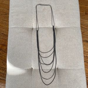 Dark gray metal multi strand necklace.